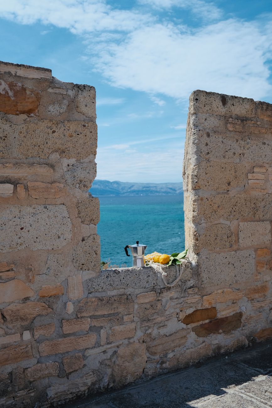 Sunlit lemon groves and steep terraced vineyards along the Mediterranean sea