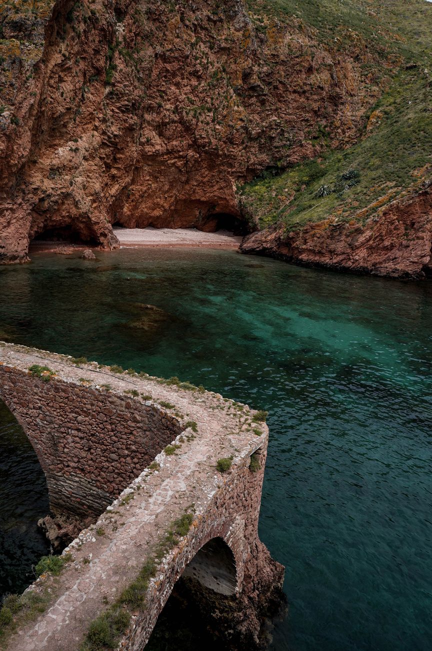 Secluded coastal bay with turquoise water and cliffs